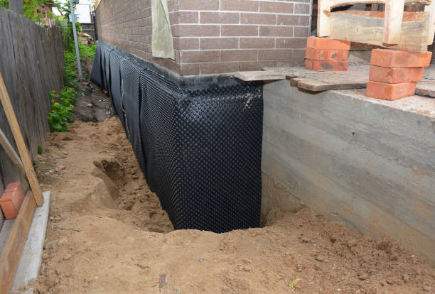 Happy homeowners after waterproofing job in Selden